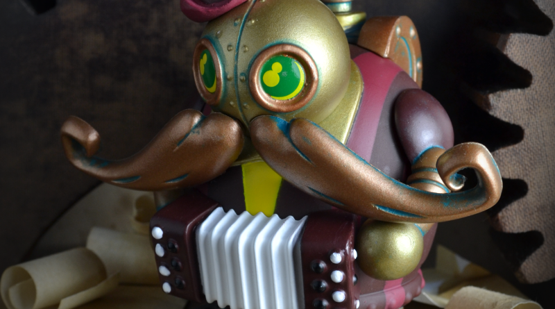 Maurice Jaques - Accordion player. Part of Mini Mechtorians Series 2 vinyl toys. Designed by Doktor A. Bruce Whistlecraft. Produced by Kidrobot. 2018.