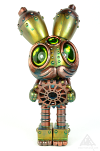 The Gear Sizer. A Mechtorian customised Spacemonkey toy from Dalek and Kidrobot.By Doktor A. Bruce Whistlecraft. 2022.Front.